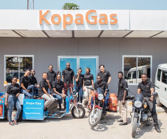 The KopaGas team stands outside their office in Dar es Salaam, Tanzania.